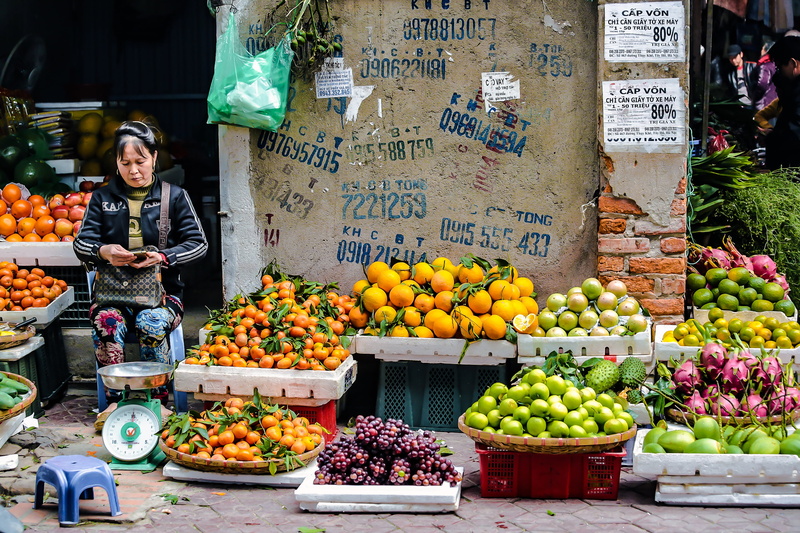 retail display, retail, stand, choice, jacket, scale, vietnam, woman, advertising, selling, healthy eating, text, street market, food and drink, orange