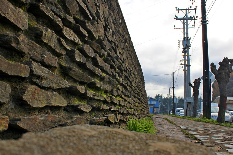 wall - building feature, electricity pylon, connection, electricity, wooden, the way forward, medieval, metal, cable, nature, sky, door, front, plant, stone wall