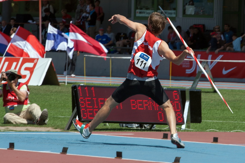 javelin throw, determination, jumping, man, skill, competition, 2K, men, motion, group of people, lifestyles, mid-air, flag, day, red, athletics, running