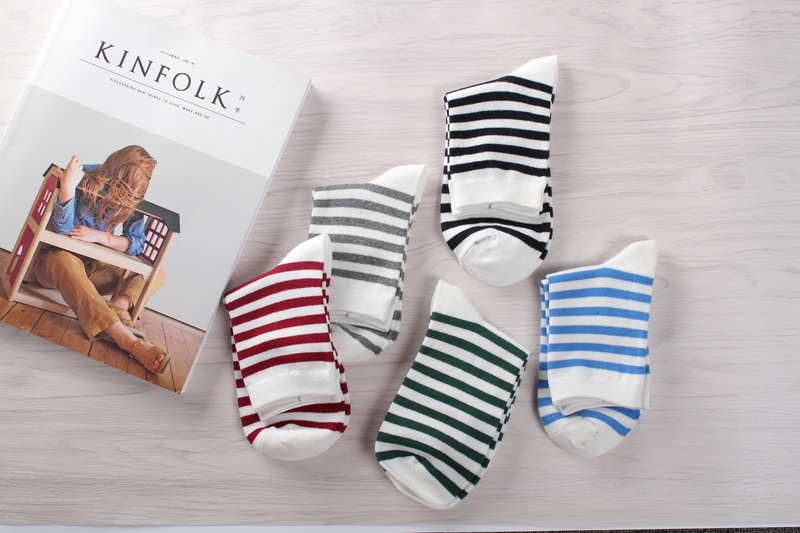 near, striped control, communication, black, western script, pairs, still life, high angle view, order, color, sock, assorted, table, colored socks, wood - material