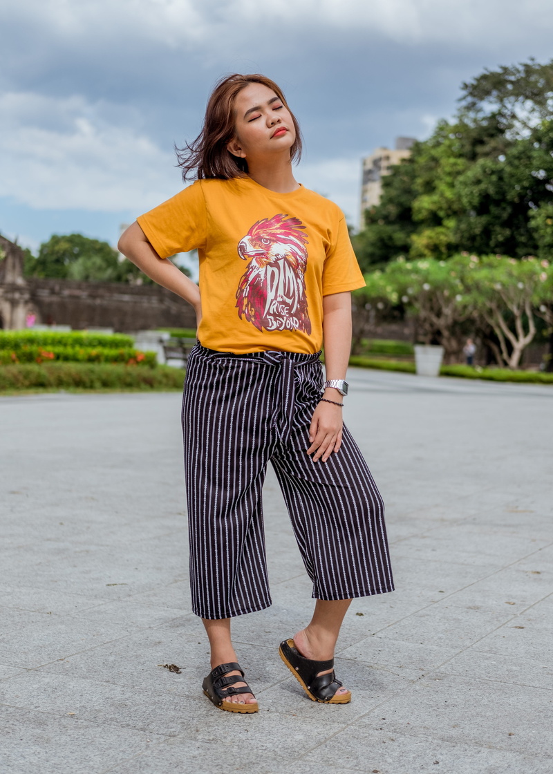 sky, lifestyles, one person, women, apparel, day, fashion, person, standing, nature, sleeve, young women, pants, outdoors, female, shorts, metropolis, shirt