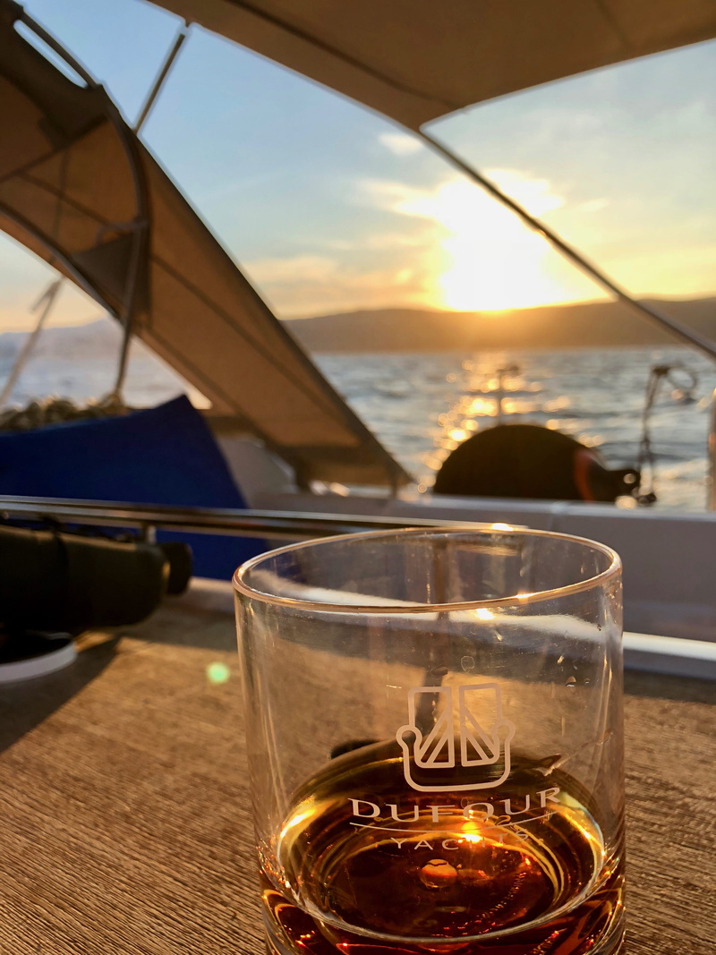 sea, glass, transportation, household equipment, refreshment, alcohol, dufour, nautical vessel, glass - material, sky, sun, drinking glass, sunset, transparent