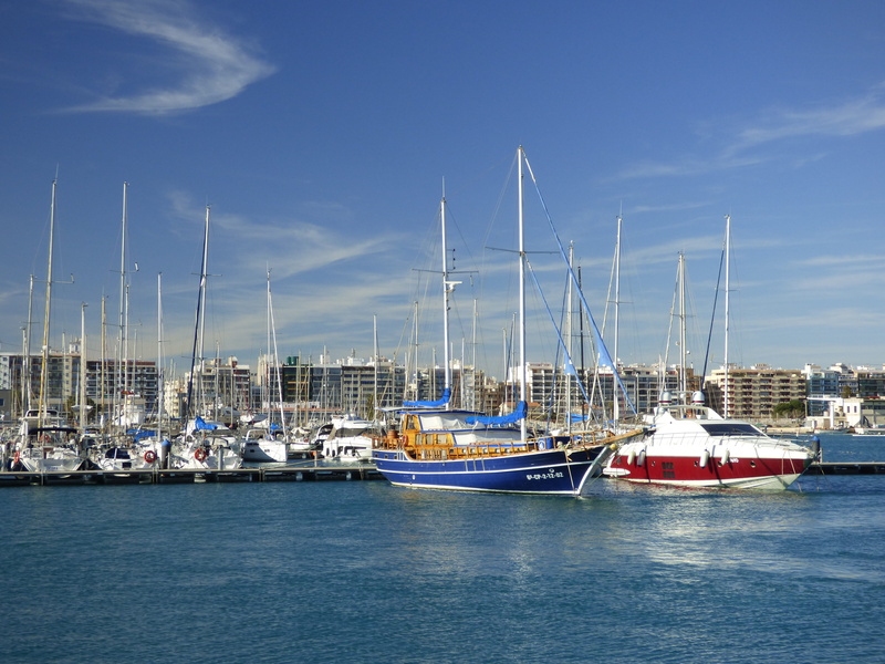 beach, dock, transportation system, pole, seashore, buildings, mode of transportation, nature, sailboats, white, watercraft, nautical, harbor, pier, blue