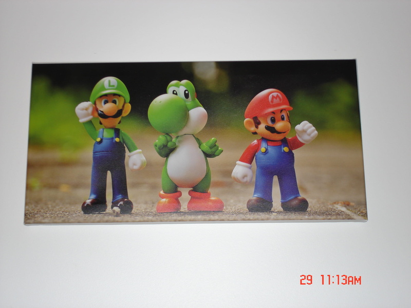 representation, indoors, human, 2K, elf, paris, person, still life, male likeness, 9 rue letelier, smiling, text, arcade game machine, childhood, super mario