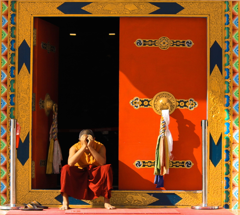 temple, shadow, trademark, orange, architecture, clothing, door, sit, worship, statue, women, monk, leisure activities, human, art and craft, dance pose