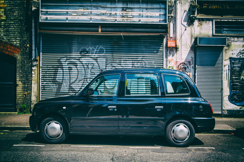 DSLR, building Exterior, street, road, London taxi, urban, car, land vehicle, building, Wide-angle, black, mode of transportation, garage, east, angle