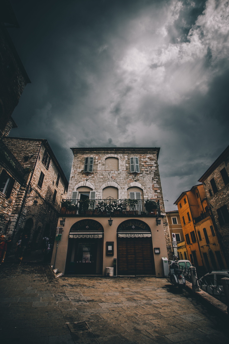 intersection, architecture, town, building exterior, city, low angle view, road, alleyway, angle, photography, outdoors, nature, gray, shop, clock tower