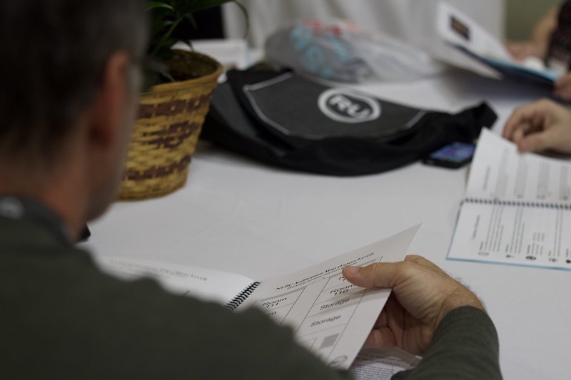vase, electronics, pc, text, book, hand, plate, trademark, writing, human hand, males, white, human body part, real people, logo, computer, rockford, occupation