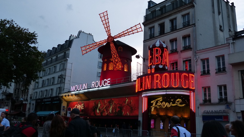 group of people, text, street, city life, building exterior, night, 2K, city, nature, representation, communication, outdoors, architecture, sky, paris