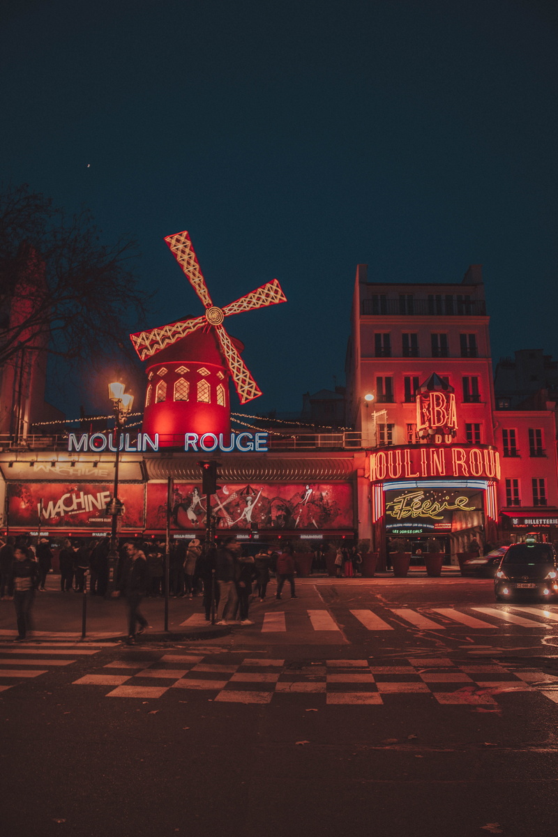 signage, downtown, vehicle, group of people, building exterior, sky, asphalt, real people, large group of people, nature, moulin rouge, human, women, france