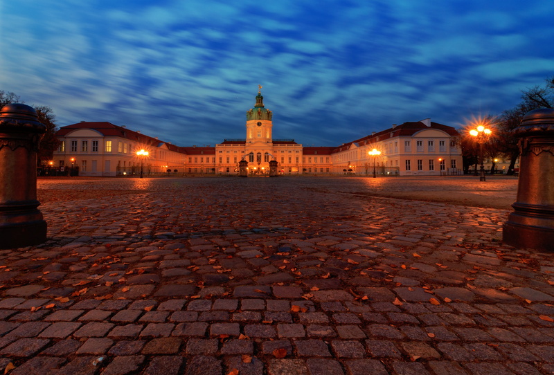 city, the past, lighting equipment, building, the way forward, cloud - sky, concrete, sky, built structure, castle, nature, places of interest, street