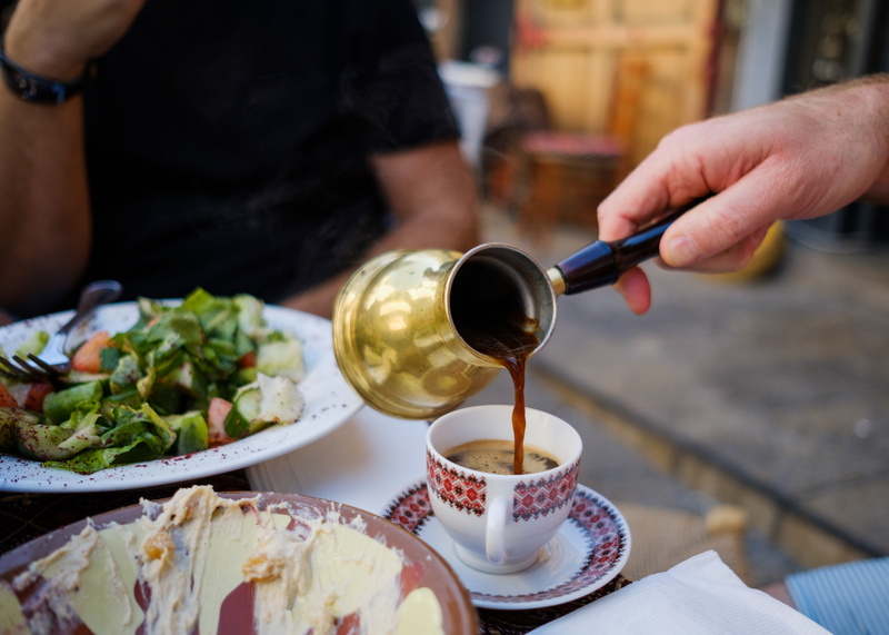 ground coffee, plate, one person, indoors, pour, israel, hummus, caffeine, hand, cup, coffee, pouring, pour over, holding, adult, old city, tel aviv-yafo