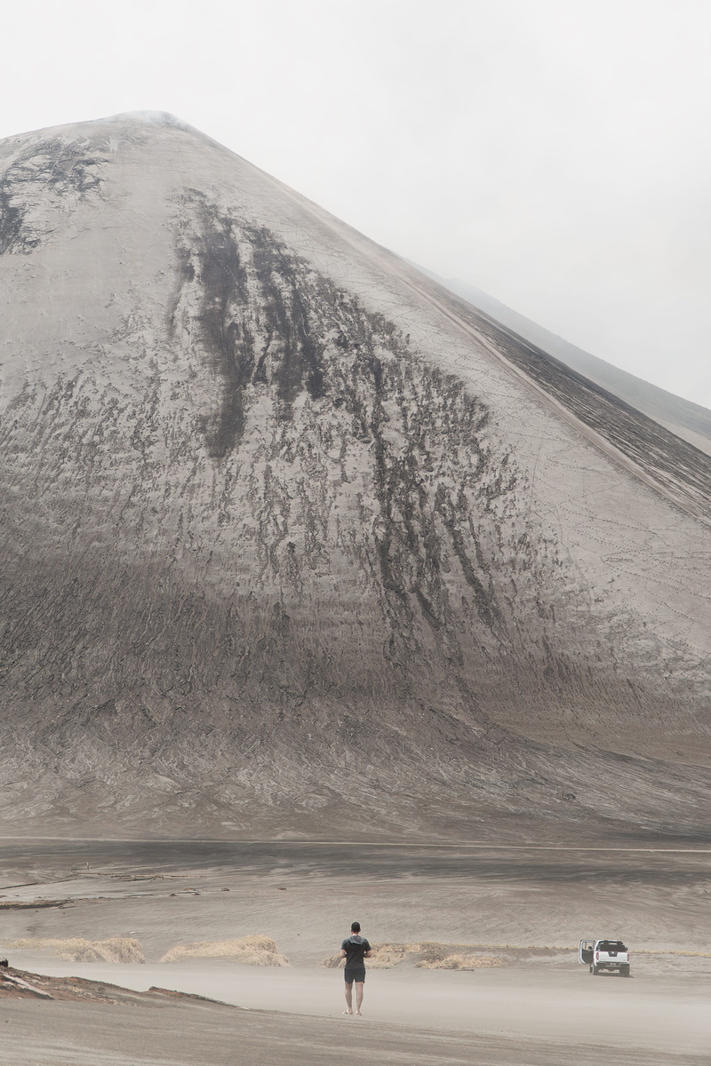 vanuatu, sand, motor vehicle, black, people, slope, landscape, volcano, standing, pacific, soil, non-urban scene, transportation, person, grassland, field