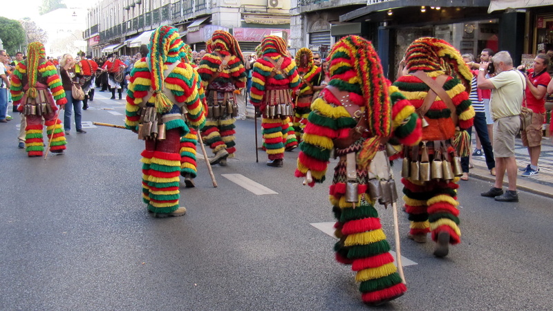 group of people, energy, standing, mask, real people, road, men, jumping, happiness, carnival, outdoors, crowd, multi colored, adult, city life, city, joy