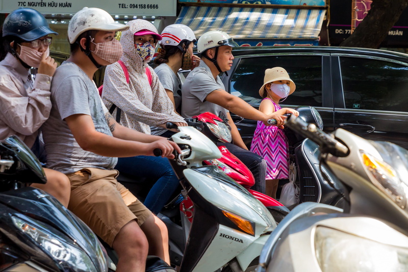 city, pollution, mode of transportation, helmet, group of people, urban, children, day, females, 2K, street, clothing, traffic, safety, scooter, hanoi
