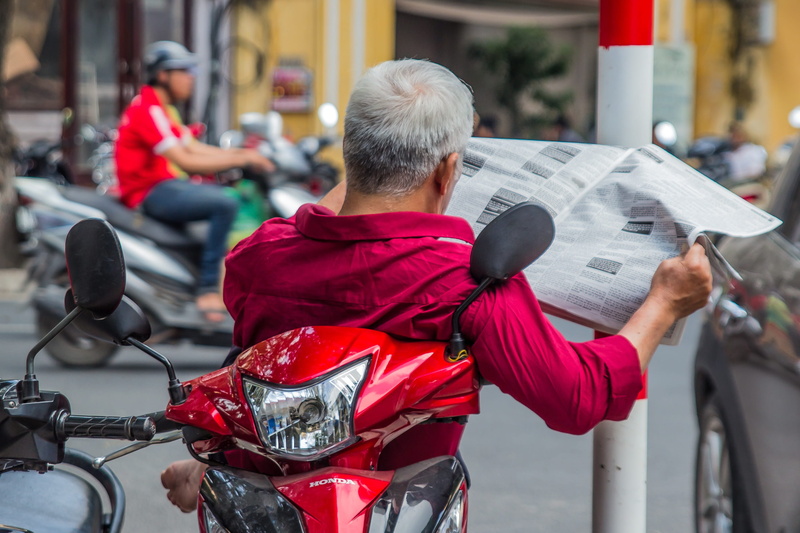 mode of transportation, depth of field, men, asia, city, adult, riding, focus on foreground, leisure activity, rear view, urban, transportation, relaxing