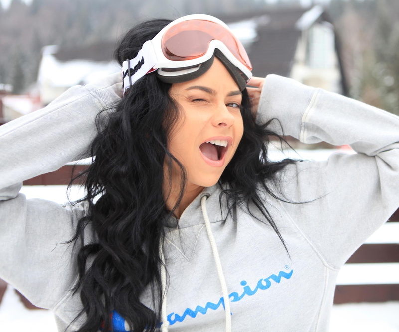 glasses, outdoors, women, winking, long hair, beautiful woman, leisure activity, focus on foreground, lifestyles, face, black hair, hands on head, mouth