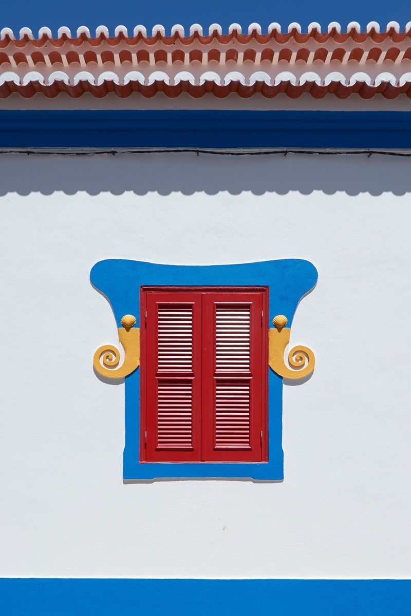 wall, lighting equipment, artists, yellow, artwork, building, red, inflatable, multi colored, built structure, street decoration, shingle, window, blue