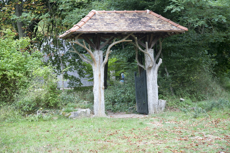 house, tranquility, roof, landscape, growth, field, entry, leaves, architecture, day, trunk, outdoors, building exterior, plant, green, roofing, no people