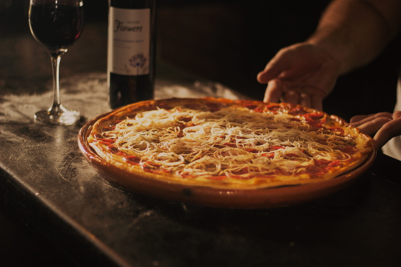 holding, sauce, red wine, person, pepperoni, rustic, pizza, dinner, pan, freshness, food, delicious, 5K, kitchen, preparation, one person, domestic room