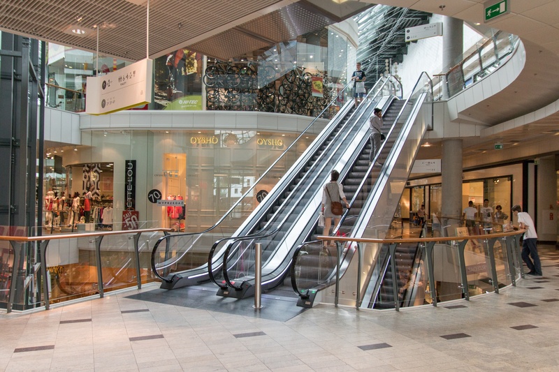incidental people, consumerism, shopping, illuminated, building exterior, staircase, gray, poland, city, day, 2K, modern, luxury, kielce, flooring, woman