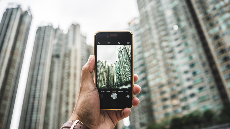 blur, cityscape, person, outdoors, black, skyscrapers, smart phone, focus, gadget, hand, one person, city, photo messaging, photography themes, apple device