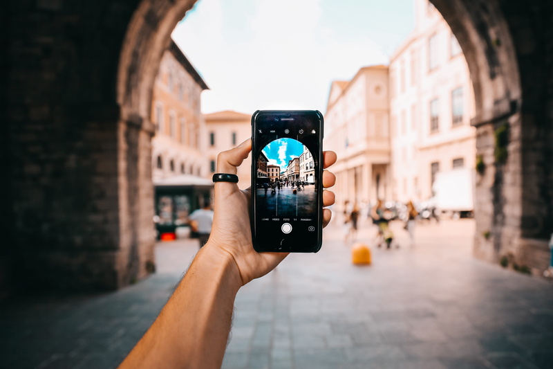 smartphone, activity, electronics, black, photographing, one person, holding, 5K, display, architecture, city, iphone, building exterior, blurred background