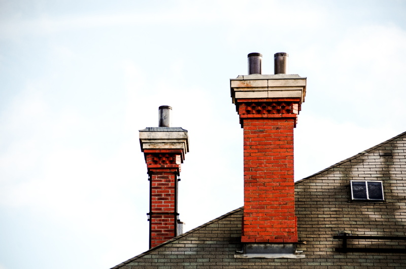 building, city, industry, building exterior, day, factory, blue sky, clear sky, outdoor, business, chimney sweeping, outdoors, tower, red, contemporary