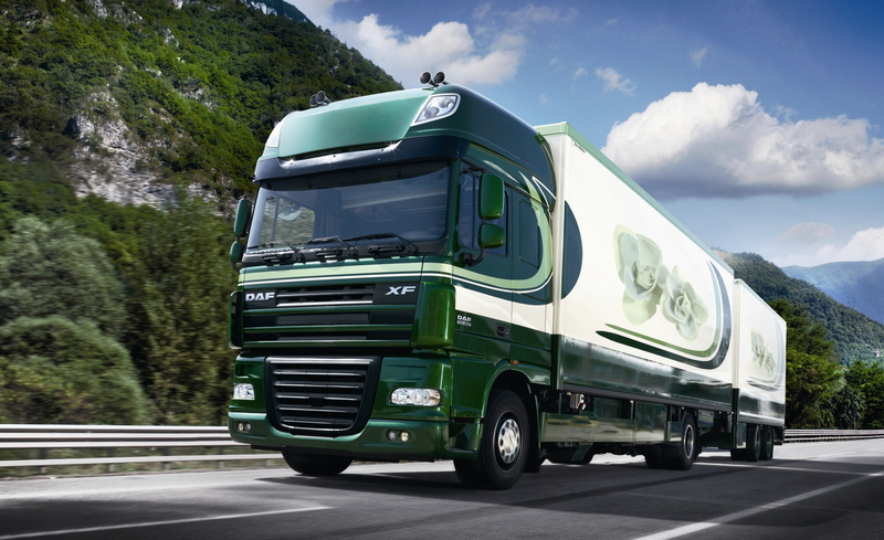 large, freight Transportation, blue, semi-Truck, motion, multiple Lane Highway, commercial Land Vehicle, plant, cloud - sky, cargo Container, mountain