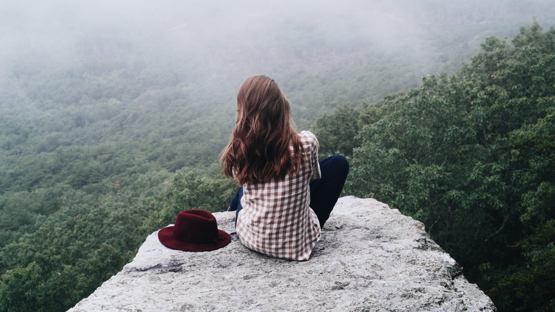 casual clothing, hairstyle, beauty in nature, nature, one person, fog, looking at view, hill, adult, day, scenics - nature, real people, hair, lifestyles