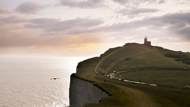 built structure, seagull, nature, sea, sky, land, seven sisters, white cliff, outdoors, cliff, mountain, sunset, beauty in nature, tranquil scene, no people