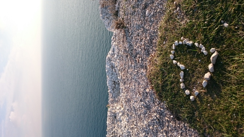 tranquil scene, horizon over water, land, high angle view, uk, beach, representation, day, outdoors, horizon, nature, heart, sunlight, water, east sussex