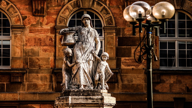 famous Place, human representation, building exterior, built structure, architectural column, art and craft, architecture, street lighting, creativity