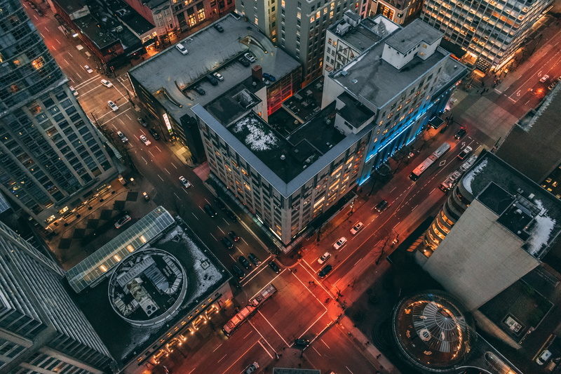 skyscraper, modern, architecture, motor vehicle, building exterior, road, car, mode of transportation, traffic, city life, concrete, gray, building, city street