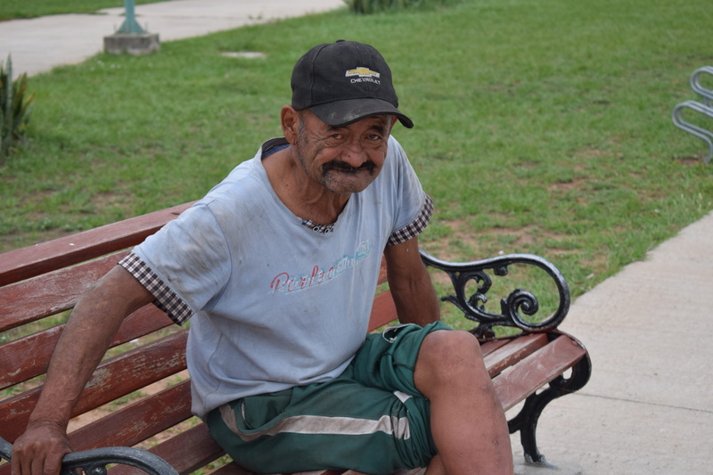 one person, front view, senior men, sitting, seat, men, asunción, looking at camera, avenida costanera josé asunción flores, real people, transportation