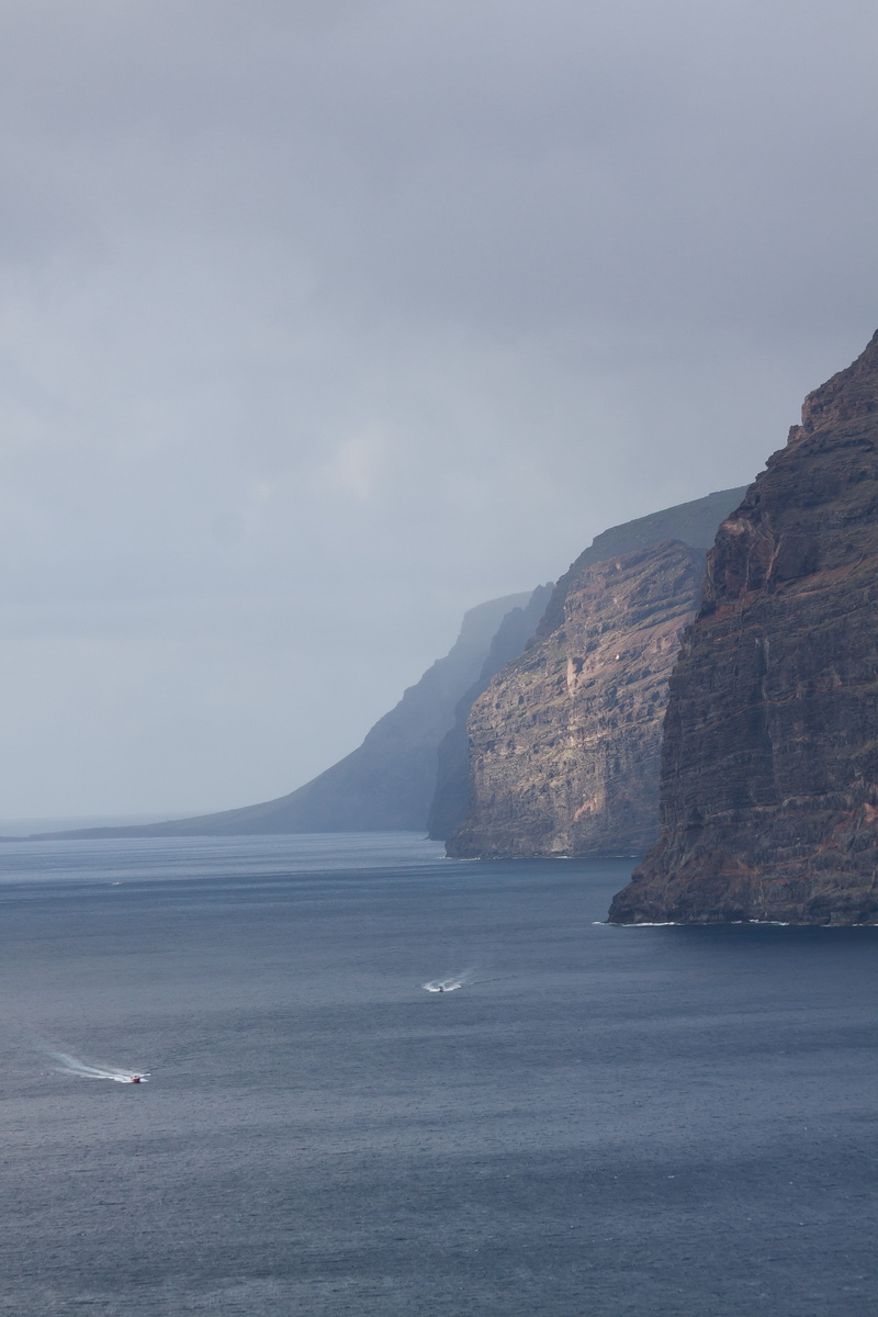 sea, water, beauty in nature, cliffs, sky, idyllic, cliff, rocky coastline, ships, day, mountain, beach, tranquility, santiago del teide, west coast, waterfront