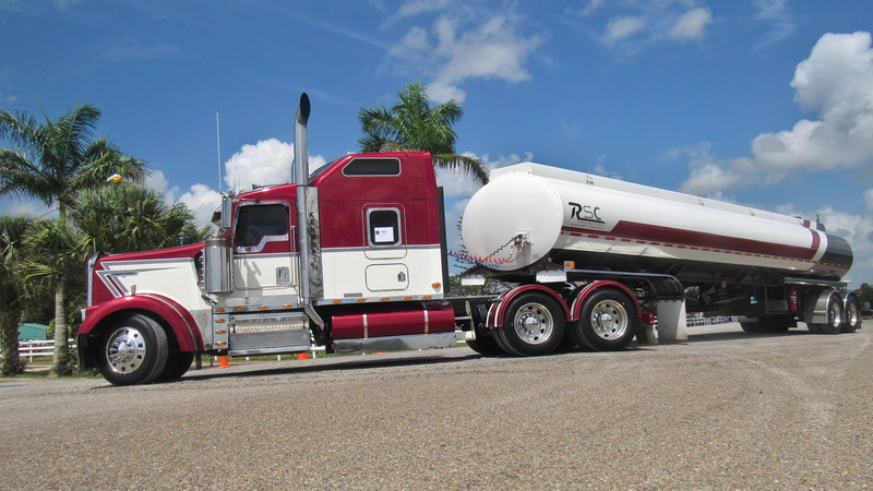 trucking, truck, no people, outdoors, motor vehicle, road, nature, commercial land vehicle, tanker, freight transportation, vehicle, cloud - sky, white
