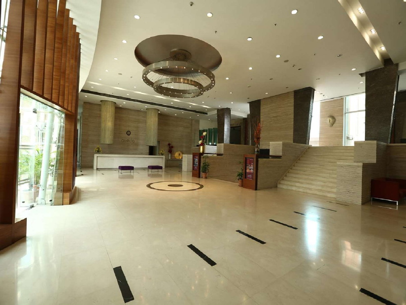 table, no people, built structure, time, empty, flooring, ceiling, indoors, luxury hotels in ludhiana, building, illuminated, mirror, architecture, reflection