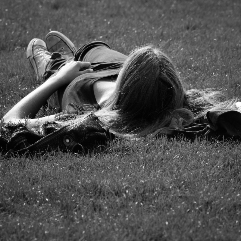 leisure activity, casual clothing, grass, outdoors, women, garden of the invalides, nature, plant, grayscale, lying down, long hair, lifestyles, relax