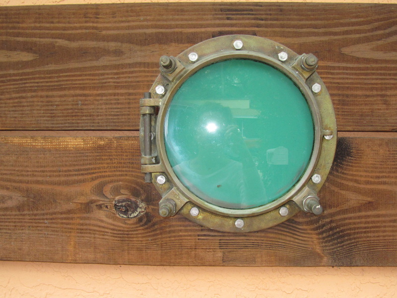 background, green color, brown, circle, wood - material, indoors, geometric shape, driftwood, port, port hole, single object, hardwood, green apple, safety