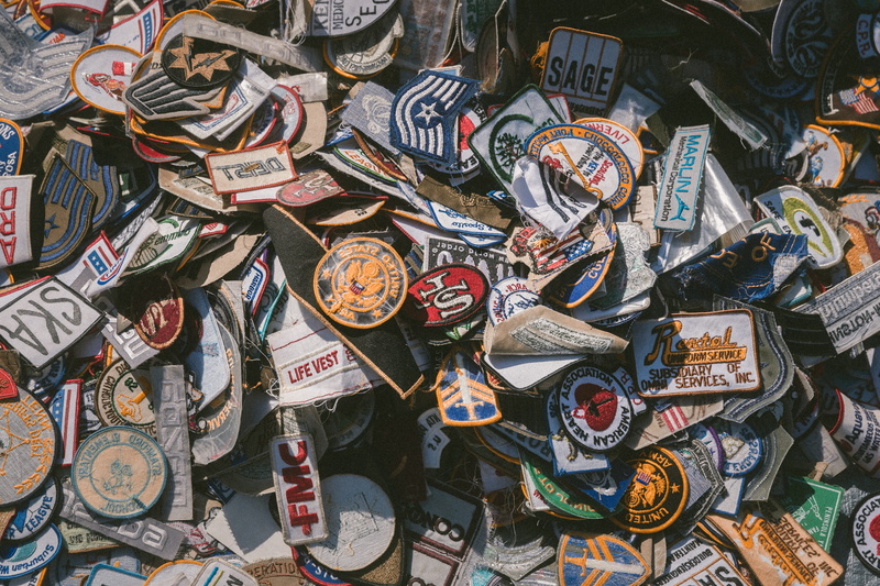 no people, high angle view, backgrounds, market, large group of objects, close-up, still life, non-western script, badge, variation, assorted, patch, bunch
