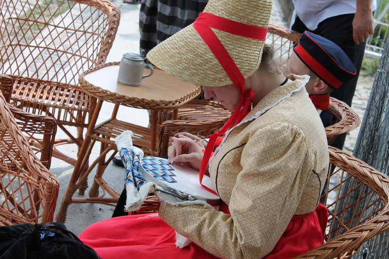 poznań, three quarter length, table, clothing, 4K, Woman, lifestyles, basket, wood - material, real people, women, Embroider, seat, warm clothing, senior adult