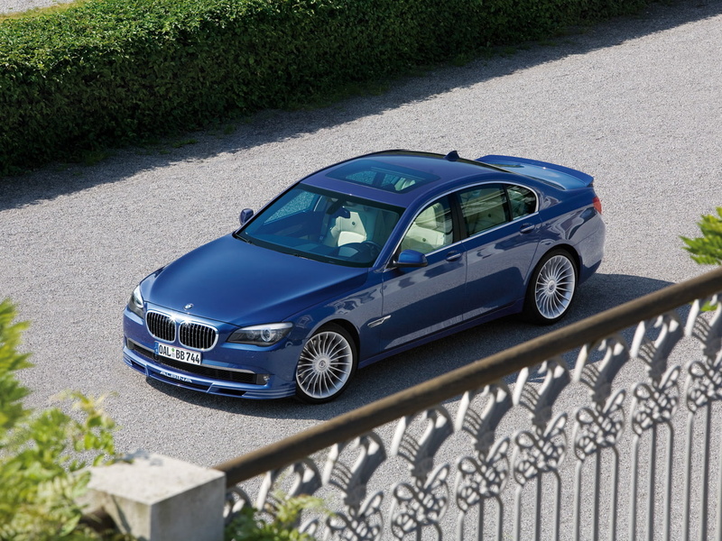railing, no people, 720P, shadow, stationary, b, high angle view, sedan, retro styled, sunlight, motor vehicle, car, outdoors, road, land vehicle, mode of transportation