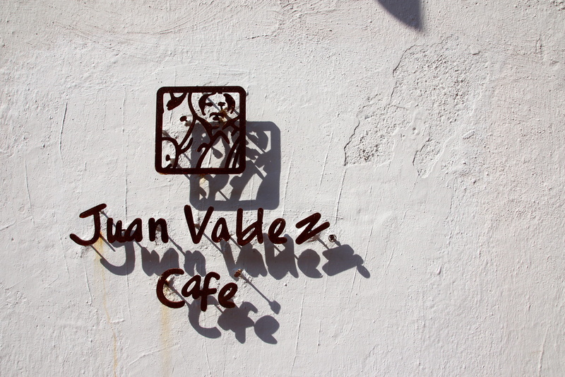 coffee, brown, cartagena, shadow, no people, outdoors, white color, text, cafe, colombia, white, built structure, script, juan valdez, creativity, day