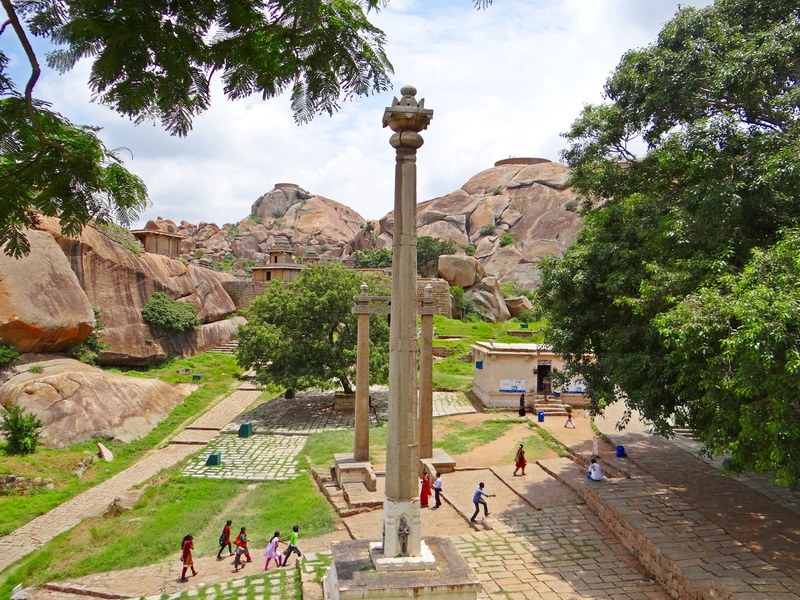 travel destinations, architectural column, archaeology, plant, crowd, built structure, visit, tree, temple, ancient civilization, outdoors, stone, fort
