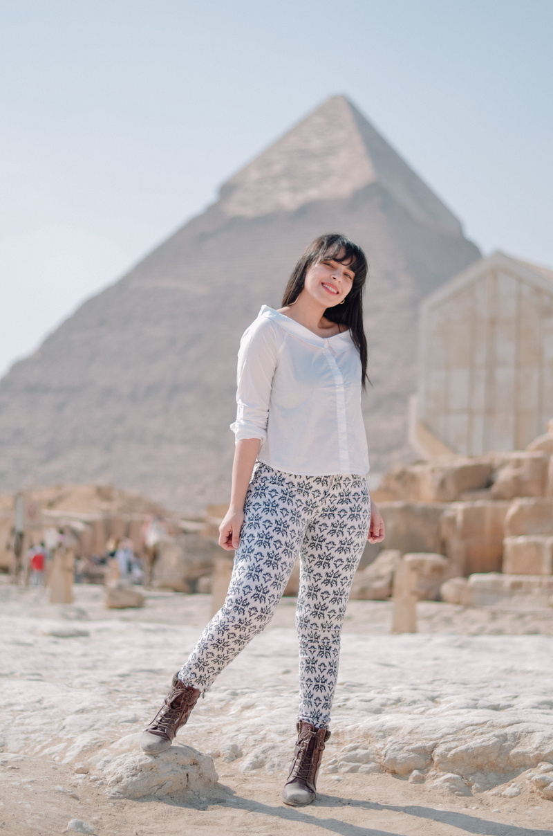 hairstyle, focus on foreground, one person, full length, beautiful woman, woman, clothing, soil, standing, person, fashion, human, brown hair, casual clothing