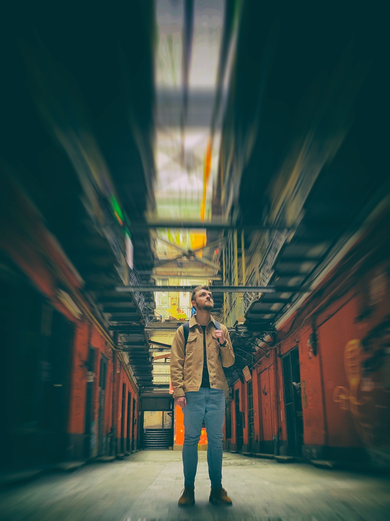 front view, clothing, lifestyles, crypt, real people, prison, banister, photography themes, one person, full length, corridor, human, illuminated, casual clothing
