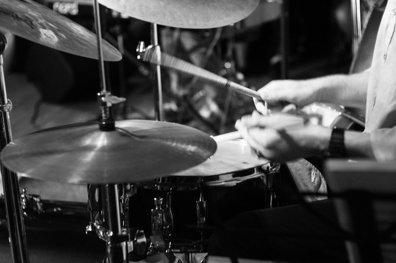 artist, musician, art, focus on foreground, music, 5K, one person, human body part, human hand, skill, holding, noir, culture, musical equipment, percussion instrument