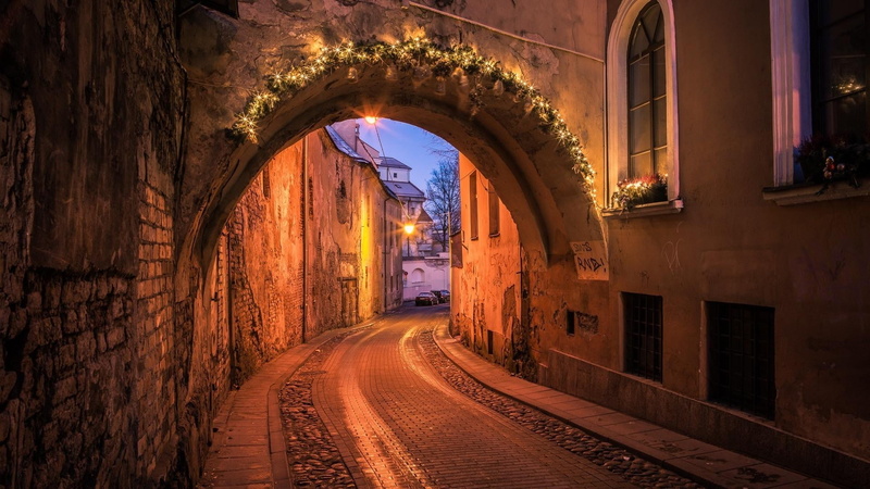 direction, building exterior, arched, diminishing perspective, evening, street, architecture, vilnius, christmas decoration, history, arch, built structure