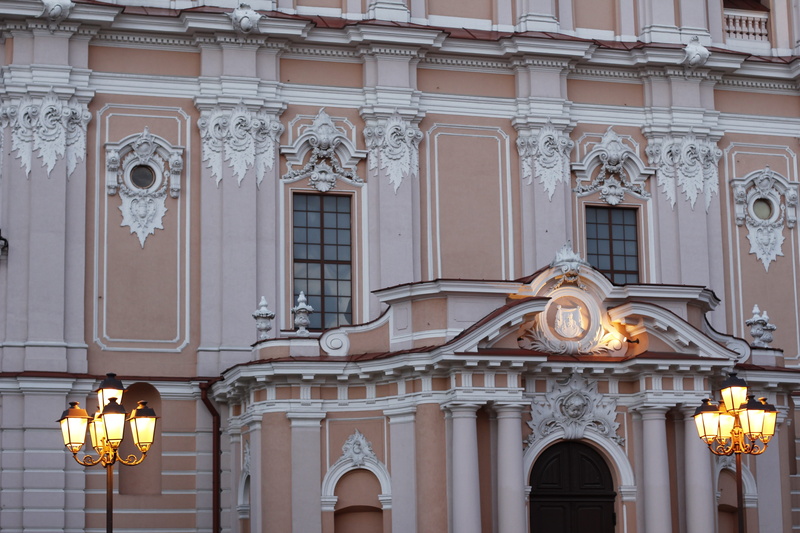 day, electric lamp, craft, facade, outdoors, ornate, city, built structure, low angle view, houses facades, arch, illuminated, window, history, art and craft